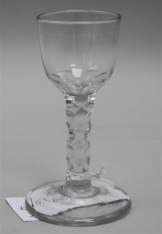 A wine glass, c.1785, with round bowl over a faceted stem, 4.75in.